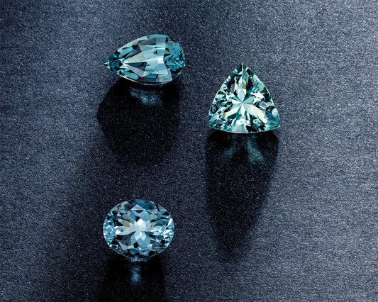 Pear, Trillion and Round Aquamarine Stones